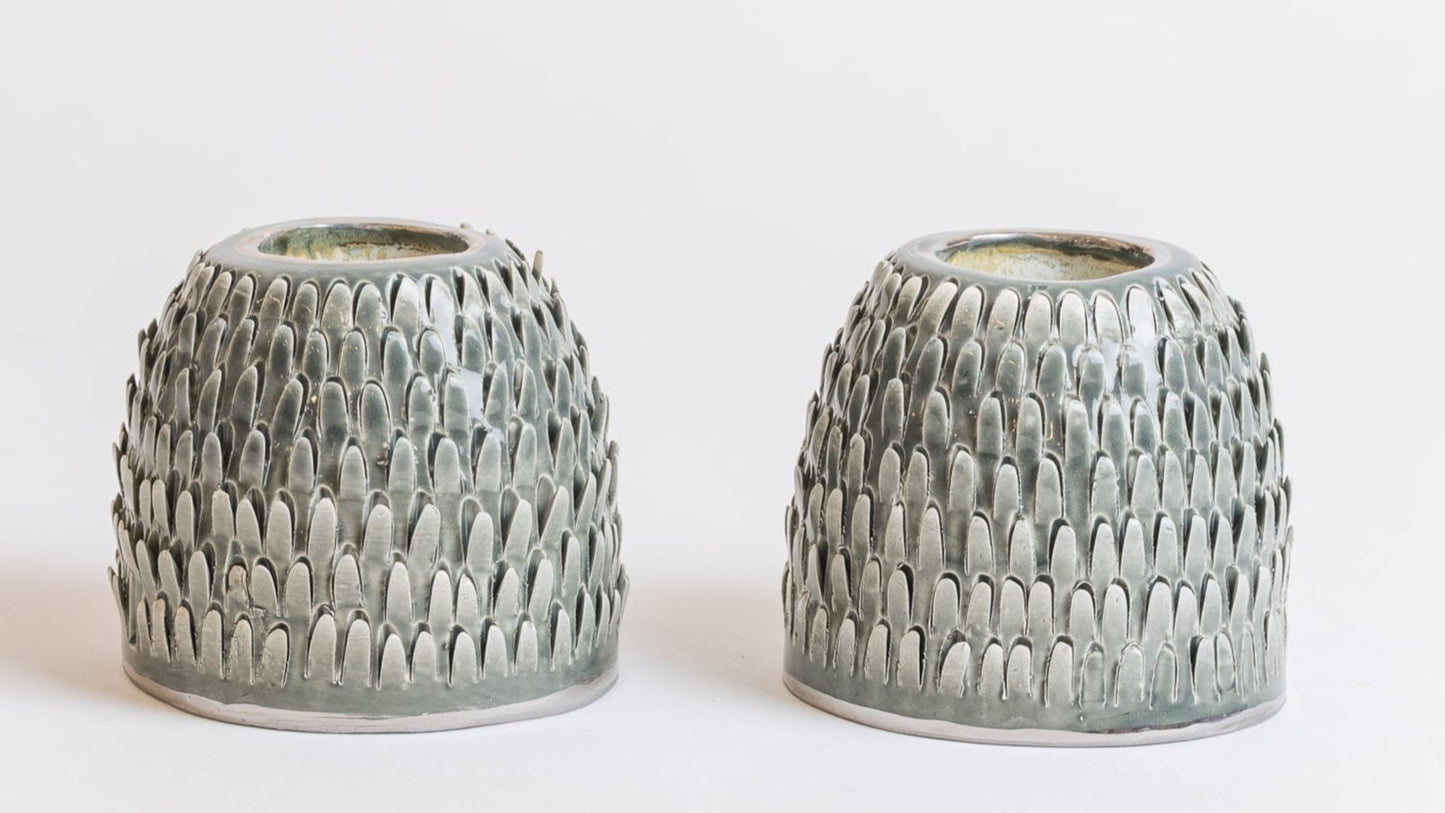 green spiked candlesticks