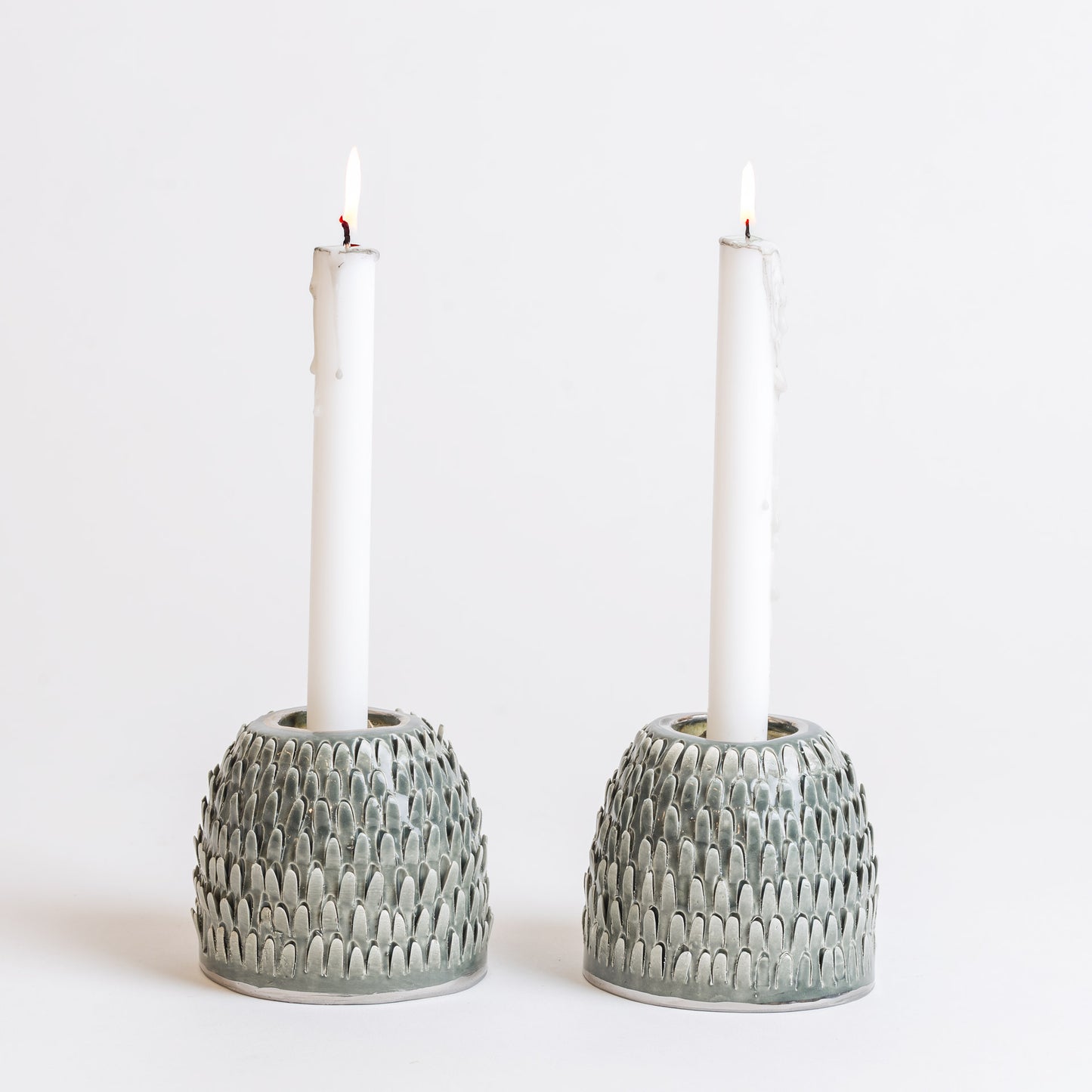 green spiked candlesticks